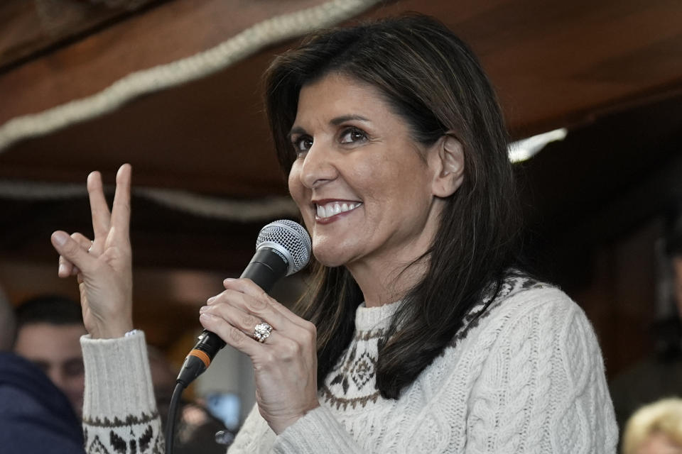 Republican presidential candidate former UN Ambassador Nikki Haley holds up two fingers as she speaks during a campaign stop at Brown's Lobster Pound in Seabrook, N.H., in Seabrook, N.H., Sunday, Jan. 21, 2024. (AP Photo/Matt Rourke)