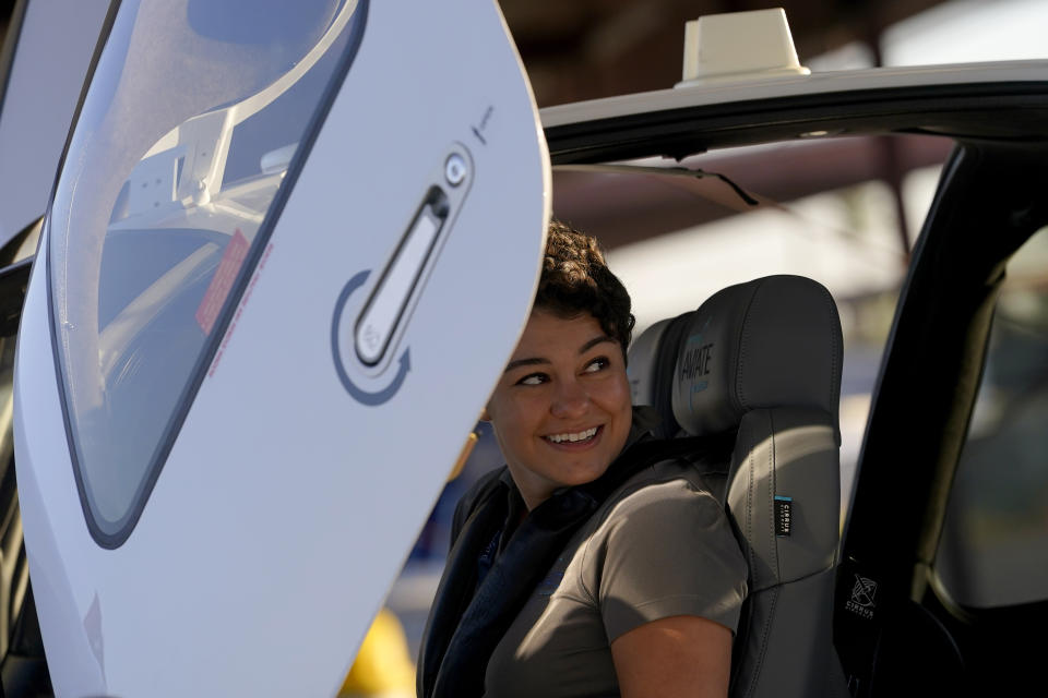 United Aviate Academy student pilot Ashley Montano inspects her aircraft prior to a flight, Friday, Oct. 28, 2022, in Goodyear, Ariz. Montano hopes that in a few years she will be flying airline jets. If she does, she'll be helping solve a critical problem facing the industry: not enough pilots. (AP Photo/Matt York)