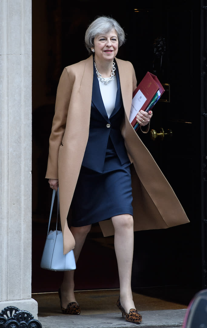 For Prime Minister's Questions, Theresa May kept warm in a camel coat [Photo: Getty]