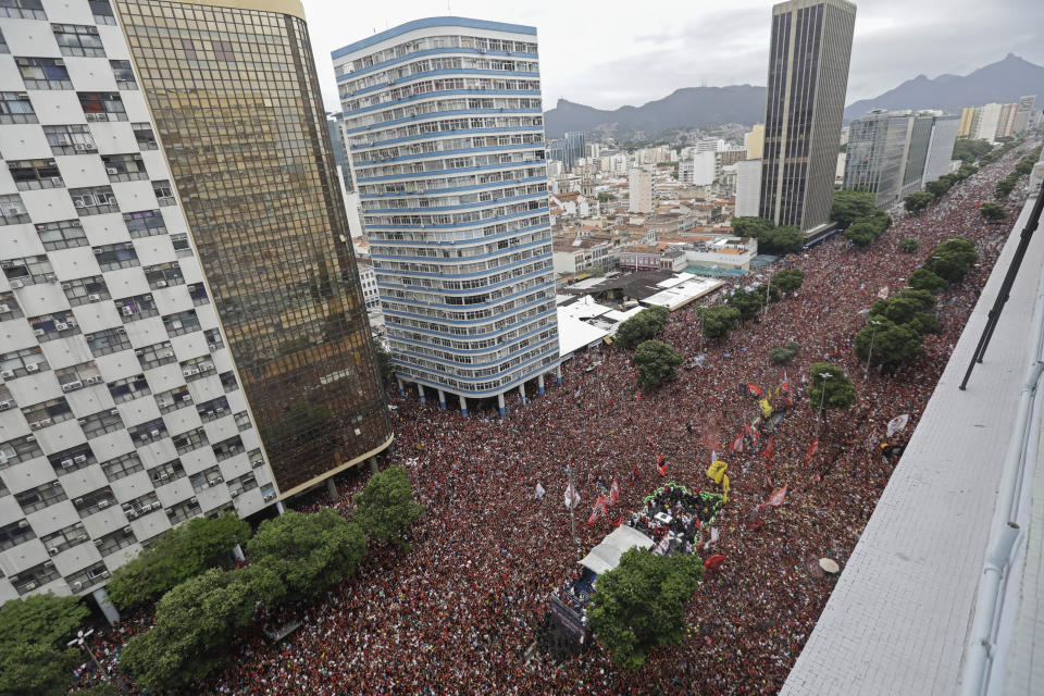 Players of Brazil's Flamengo parade at their arrival in Rio de Janeiro, Brazil, Sunday, Nov. 24, 2019. Flamengo overcame Argentina's River Plate 2-1 in the Copa Libertadores final match on Saturday in Lima to win its second South American title. (AP Photo/Silvia Izquierdo)