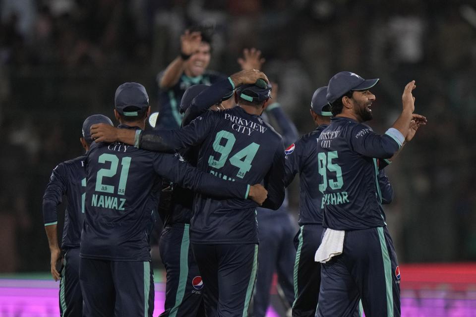 Pakistan's players celebrate after winning the fourth twenty20 cricket match between against England, in Karachi, Pakistan, Sunday, Sept. 25, 2022. (AP Photo/Anjum Naveed)