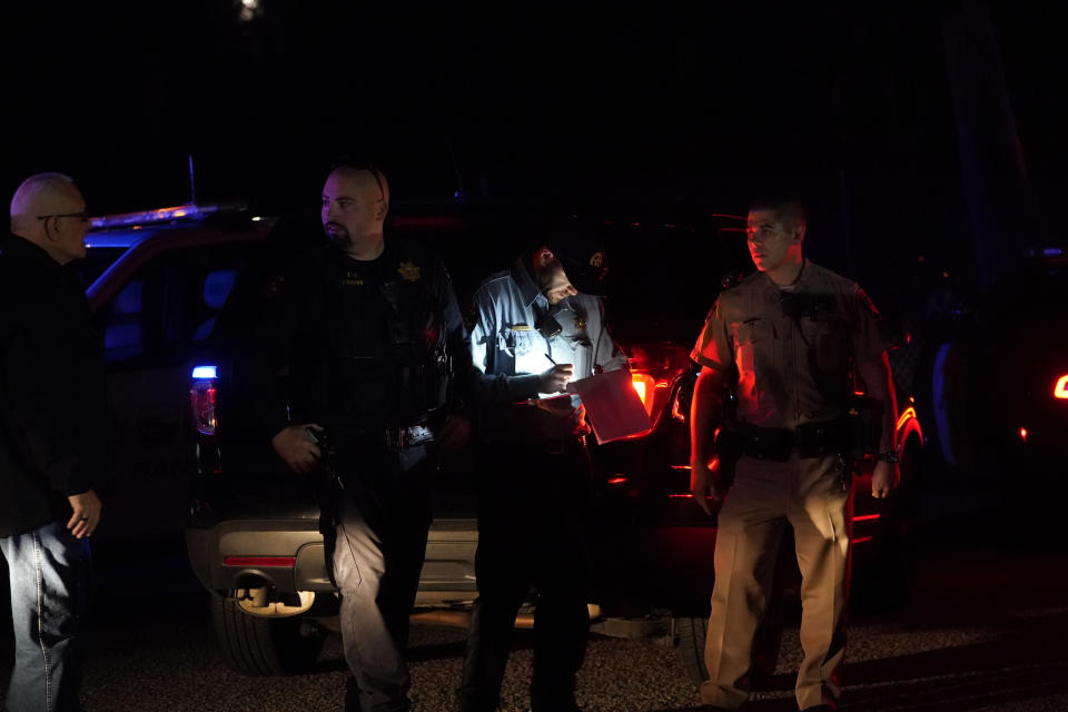 Law enforcement personnel control the scene of a shooting Monday, Jan. 23, 2023, in Half Moon Bay, Calif. Multiple people were killed in two related shootings Monday at a mushroom farm and a trucking firm in a coastal community south of San Francisco, and officials say a suspect is in custody. (AP Photo/Jeff Chiu)