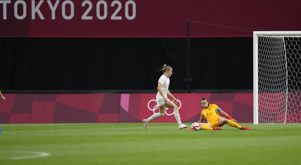 Canada's Janine Beckie, left, kicks the ball to score her side's 2nd goal during a women's soccer match against Chile at the 2020 Summer Olympics, Saturday, July 24, 2021, in Sapporo, Japan. (AP Photo/Silvia Izquierdo)