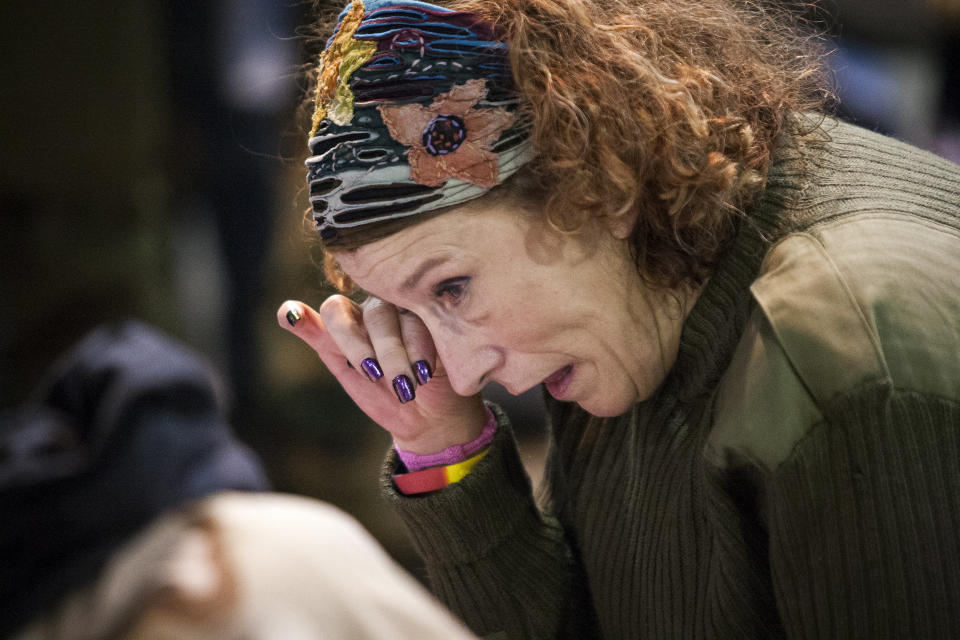 Virginia McIntyre, a U.S. Air Force veteran from Buffalo, N.Y., wipes tears from her eyes during an emotional forgiveness ceremony for veterans at the Four Prairie Knights Casino &amp; Resort on the Standing Rock Sioux Reservation on Monday.