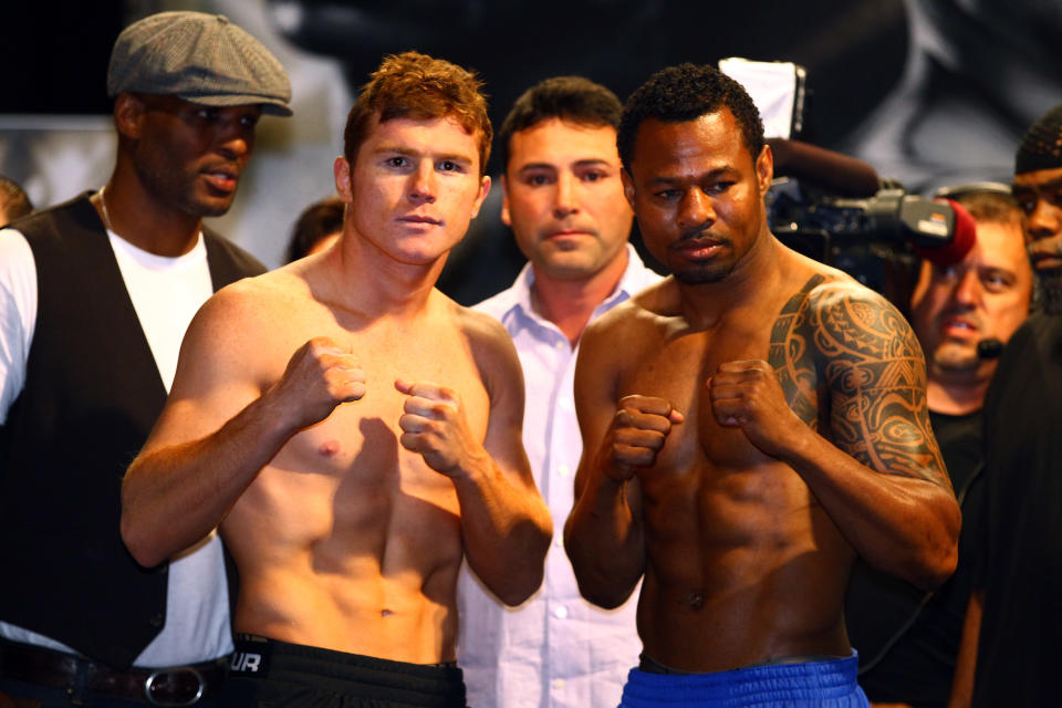 LAS VEGAS, NV - MAY 04: WBC super welterweight champion Saul Alvarez (L) and Shane Mosley pose during the official weigh-in for their bout at the MGM Grand Garden Arena on May 4, 2012 in Las Vegas, Nevada. Alvarez will defend his title against Mosley on May 5, 2012 in Las Vegas. (Photo by Al Bello/Getty Images)