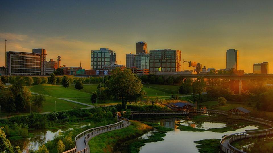 Footpath By Pond In Park Against Sky in Little Rock