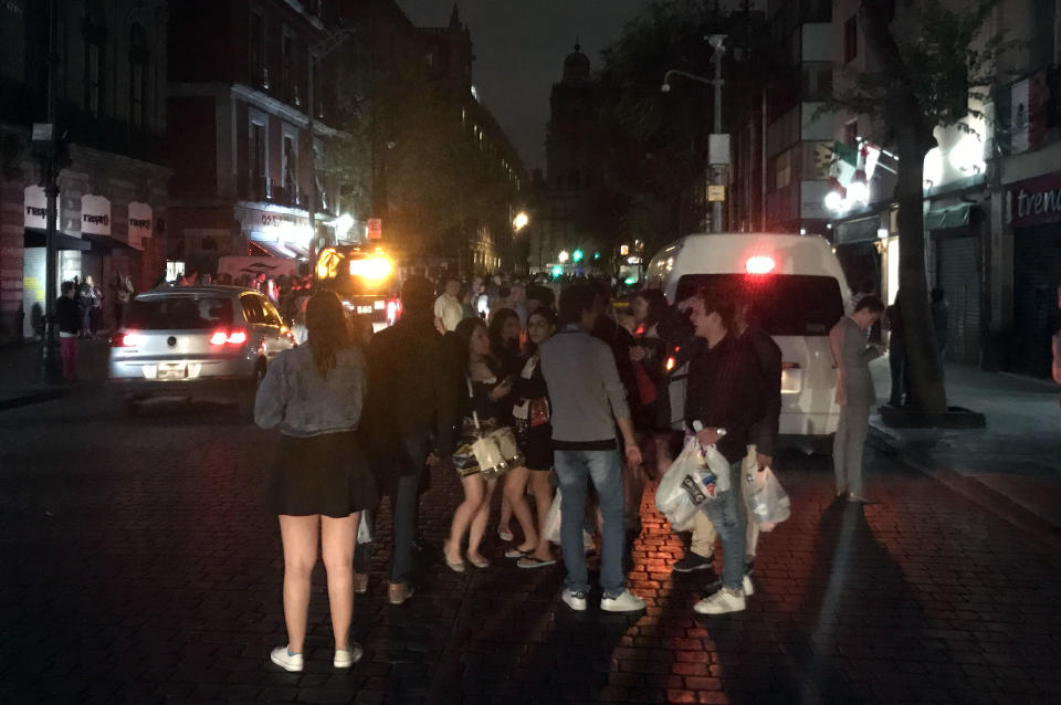 <p>People react on a street in downtown Mexico City during an earthquake, on September 7, 2017.<br> An earthquake of magnitude 8.0 struck southern Mexico late Thursday and was felt as far away as Mexico City, the US Geological Survey said, issuing a tsunami warning. It hit offshore 120 kilometers (75 miles) southwest of the town of Tres Picos in the state of Chiapas. (Alfredo Estrella/AFP/Getty Images) </p>