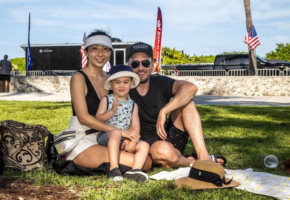 A family from Canada from left- Alice Wang and her husband Ryan Skene with their son Brayden Skene enjoy the nice weather during The National Salute to America’s Heroes Air and Sea Show 2023 presented by Hyundai in Miami Beach. on Saturday, May 27, 2023.