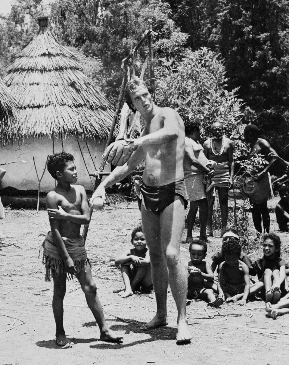 Ron Ely in August 1966 on the set of "Tarzan," teaching kids baseball in a remote Mexican village that was the set for an African village in the TV series.