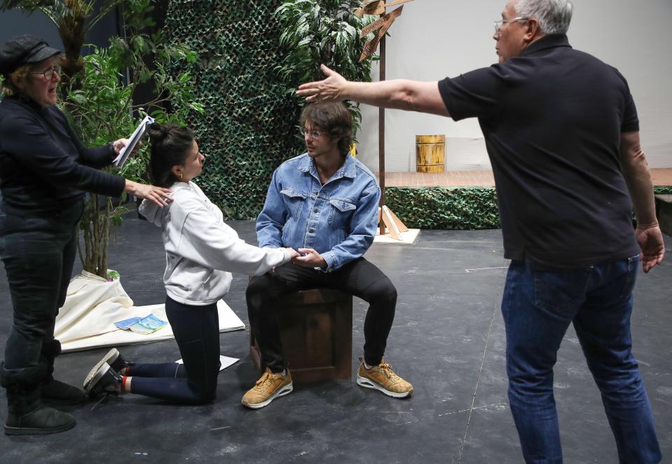 Shelby Victoria, white sweatshirt, and Christian Fonte, seated, rehearse for the Desert Theatricals production of "South Pacific" at the Rancho Mirage Amphitheater, Feb. 6, 2023.  At right is choreographer Ray Limon and at left is stage manager Lee Stone