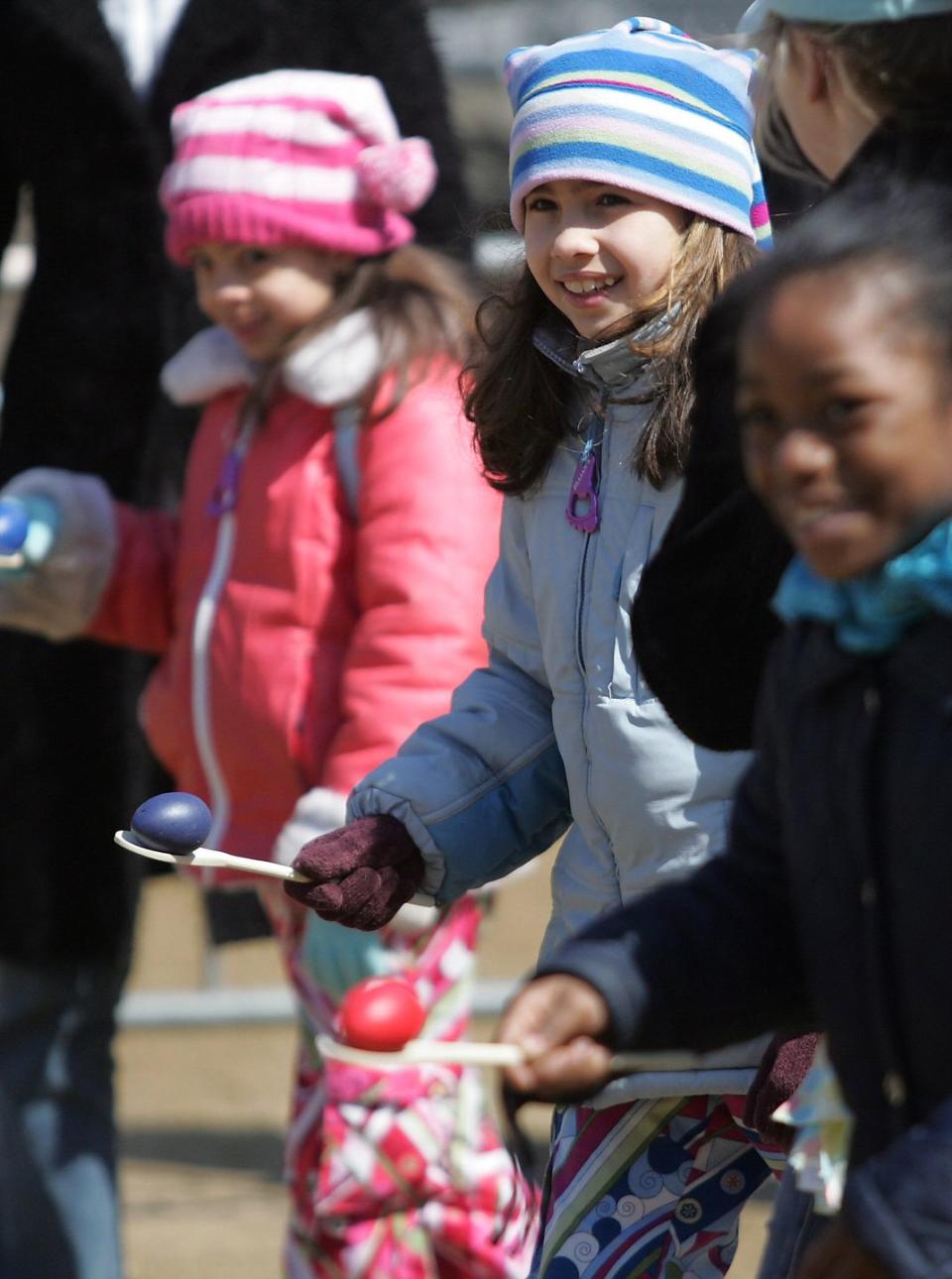 kids await the start of an egg and spoon race during the ann