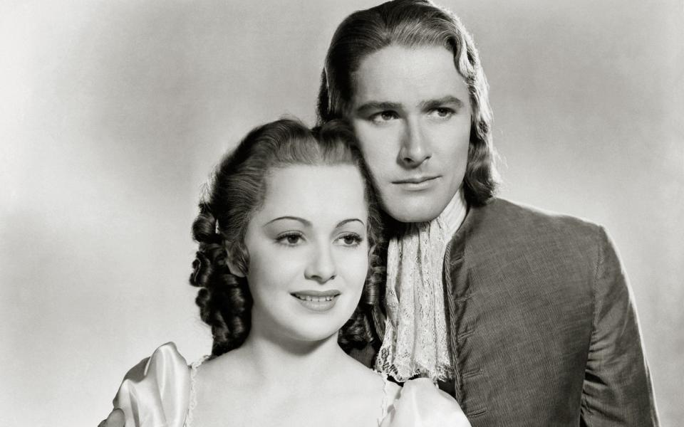 In a publicity shot for Captain Blood with Errol Flynn, with whom she made eight films -  The Legacy Collection