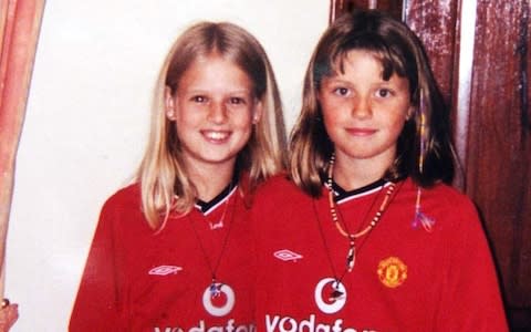 Holly and Jessica in their football shirts. The photo was taken shortly before they disappeared - Credit:  BRIAN SMITH