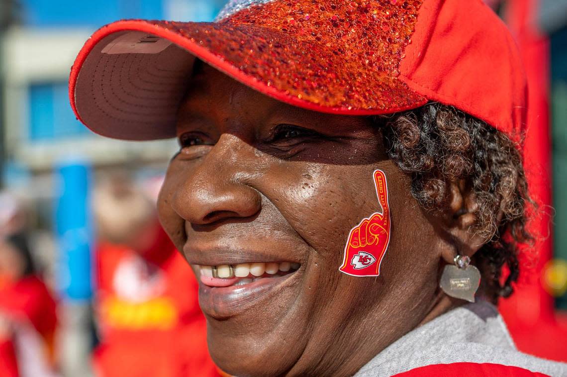 LaDonna Cartwright wears Kansas City Chiefs themed stickers on her face before riding the KC Streetcar during a Red Friday rally on Feb. 10, 2023, in Kansas City. Cartwright says she’s been a Chiefs fan since 1970.
