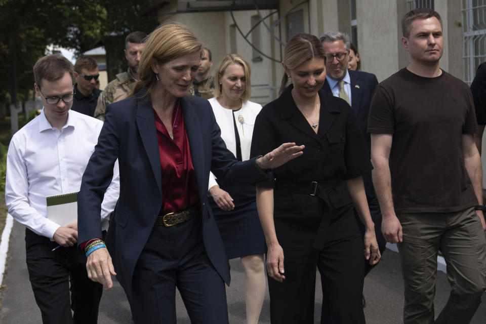 U.S. Agency for International Development Administrator Samantha Power, left, talks with Ukraine's first lady Olena Zelenska as they visit a health clinic in Irpin, Ukraine, Wednesday, July 19, 2023. (AP Photo/Jae C. Hong)