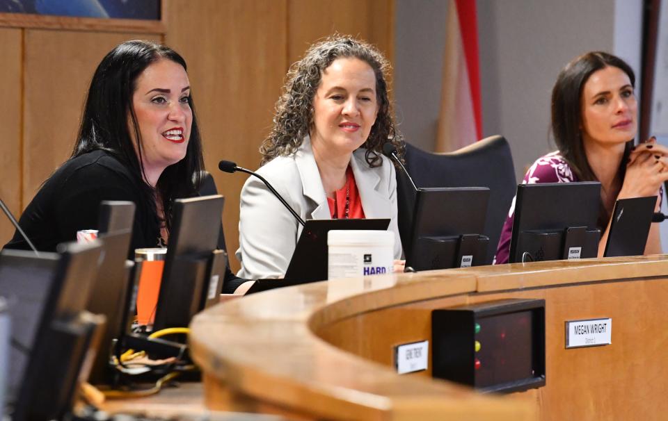 Megan Wright, Katye Campbell and Jennifer Jenkins at Tuesday's school board meeting. Brevard's school board voted Tuesday to remove "The Nowhere Girls" by Amy Reed from all district shelves.