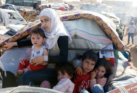 Syrian refugees prepare to return to Syria from the Lebanese border town of Arsal, Lebanon June 28, 2018. REUTERS/Mohamed Azakir