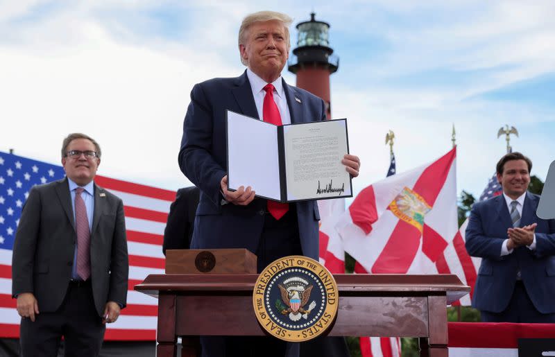 FILE PHOTO: U.S. President Trump signs an extension of the ban on Florida offshore drilling in Jupiter, Florida