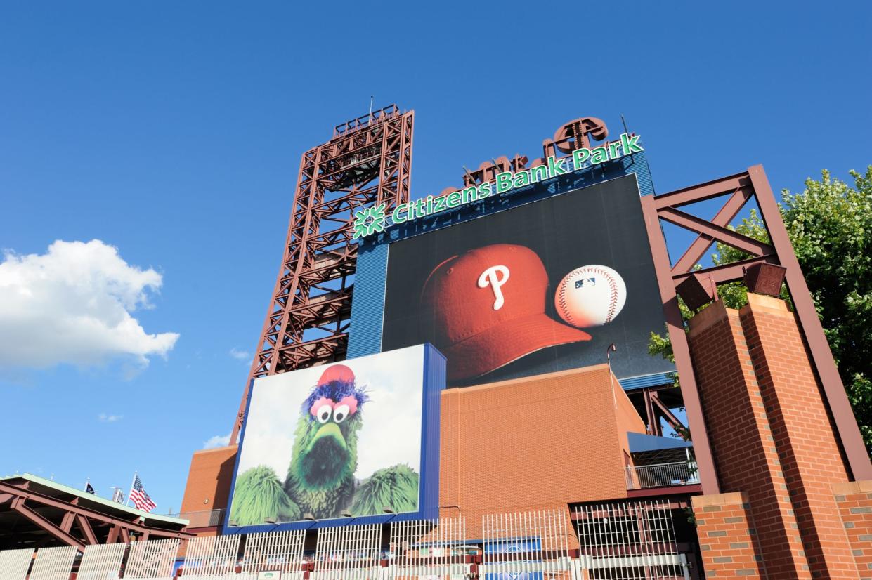 Signs on exterior of Citizens Bank Park, Philadelphia, home of the Philadelphia Phillies with clear blue sky in the background