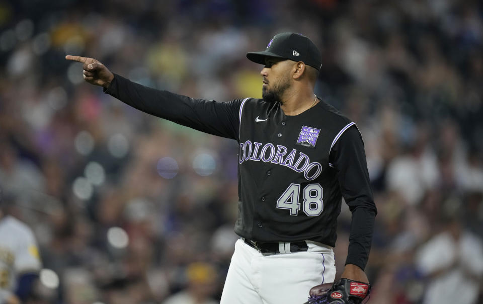 Colorado Rockies starting pitcher German Marquez reacts after Milwaukee Brewers' Avisail Garcia hit into a double play to end the top of the sixth inning of a baseball game Thursday, June 17, 2021, in Denver. (AP Photo/David Zalubowski)