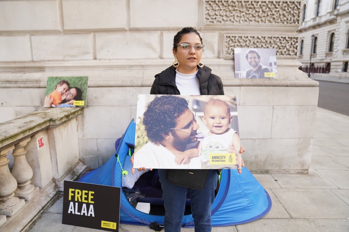 Sanaa Seif, the sister of writer Alaa Abd el-Fattah, a British-Egyptian activist imprisoned in Egypt, protests outside the Foreign Office (Stefan Rousseau/PA) (PA Wire)