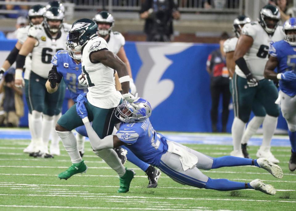 Detroit Lions safety Tracy Walker III (21) tackles Philadelphia Eagles receiver A.J. Brown during the first half at Ford Field, Sept. 11, 2022.