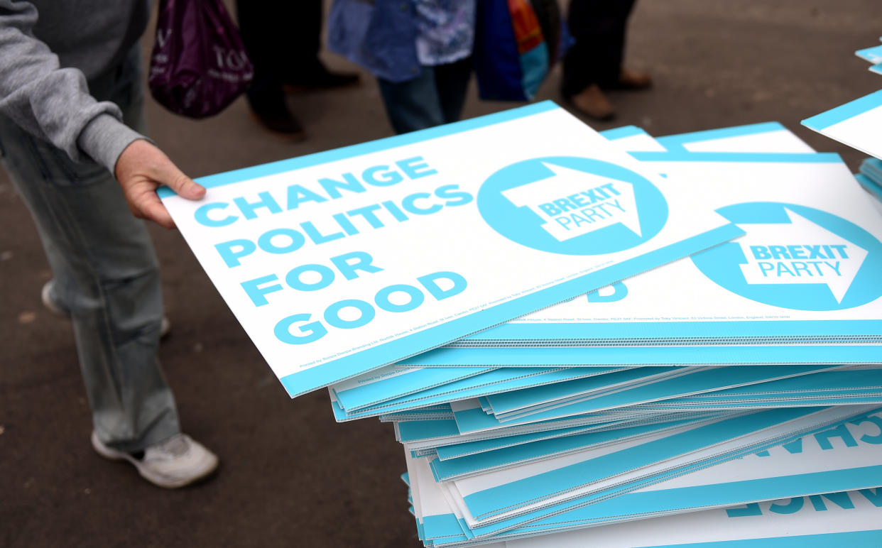 People take away Brexit Party placards after a rally in Clacton-on-Sea, Essex (Picture: PA)