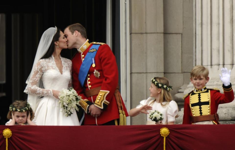 <div class="inline-image__caption"><p>Britain's Prince William and his wife Catherine, Duchess of Cambridge kiss on the balcony at Buckingham Palace, watched by bridemaids Grace van Cutsem (L) and Margarita Armstrong-Jones and pageboy Tom Pettifer, after their wedding in Westminster Abbey, in central London April 29, 2011.</p></div> <div class="inline-image__credit">Dylan Martinez/Reuters</div>