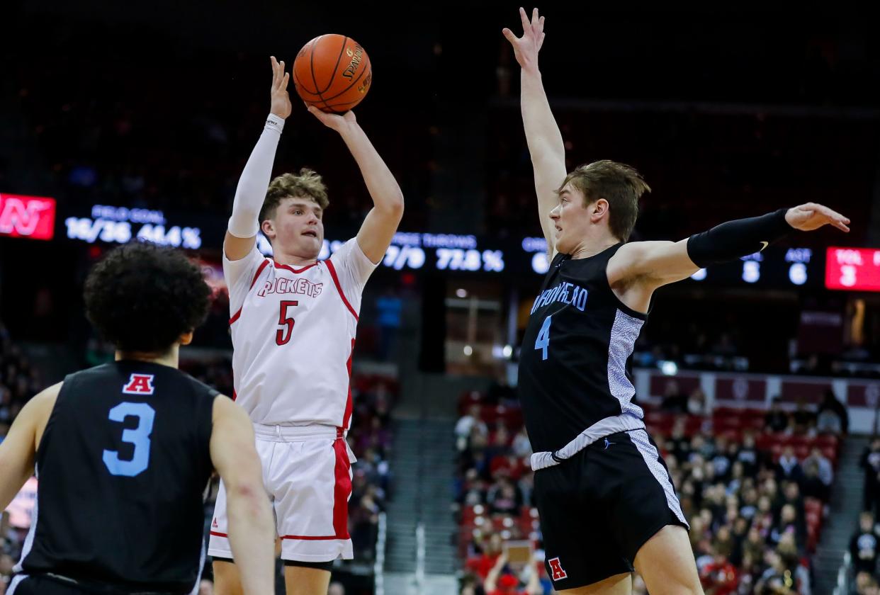 Neenah's Cal Klesmit (5) shoots over Arrowhead's Mac Wrecke (4) at the WIAA Division 1 state tournament earlier this month. The two were set to play together for the University of Wisconsin-Green Bay next season, but Klesmit reopened his recruitment Friday.