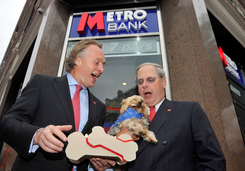 FILE PHOTO: Chairman Thomson and Vice Chairman Hill pose outside the first branch of Metro Bank in Holborn in central London