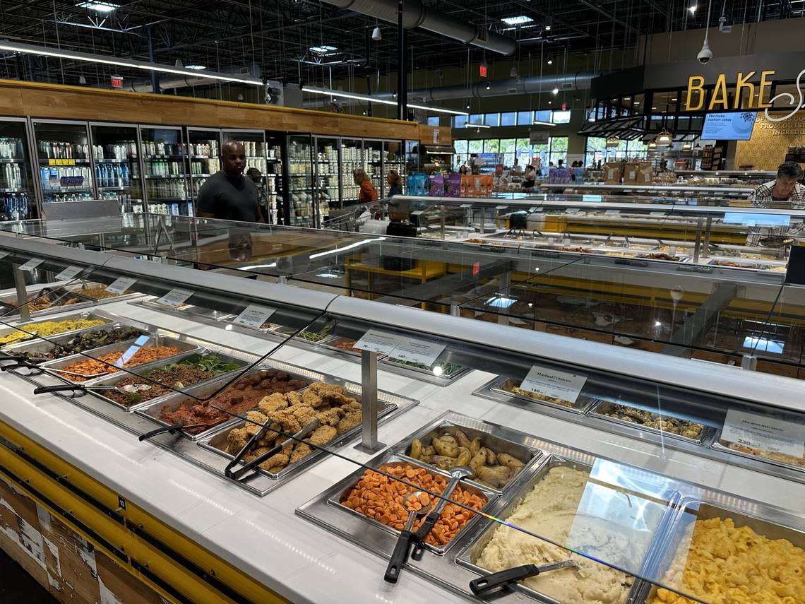 Whole Foods Market’s hot food bar in the foreground at its Pinecrest location on Dec. 7, 2023. Scott Bova, Whole Foods’ vice president of culinary, said the bars bring in seasonal selections.