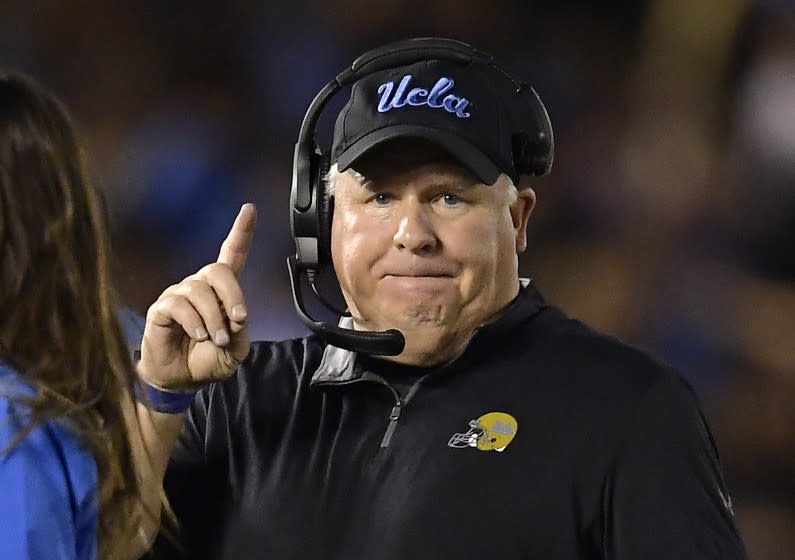 FILE - In this Oct. 20, 2018 file photo UCLA head coach Chip Kelly gestures during the first half.
