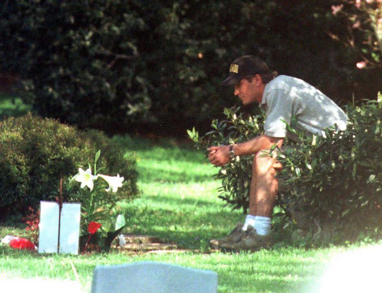 JonBenet Ramsey's brother, Burke, spends time at her grave at St. James Episcopal Cemetery, in Marietta, Ga. on Aug. 17, 2006. (Photo: John Barrett/Globe Photos via ZUMAPRESS.com)