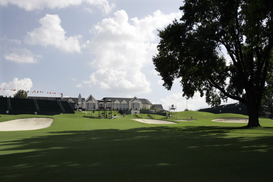 FILE - In this Aug. 5, 2007, file photo, the 18th fairway with the Southern Hills Country Club clubhouse visible is viewed at the 89th PGA Golf Championship in Tulsa, Okla. The 2022 PGA Championship, originally scheduled for Trump National in New Jersey, will be played at Southern Hills. (AP Photo/Rob Carr, File)