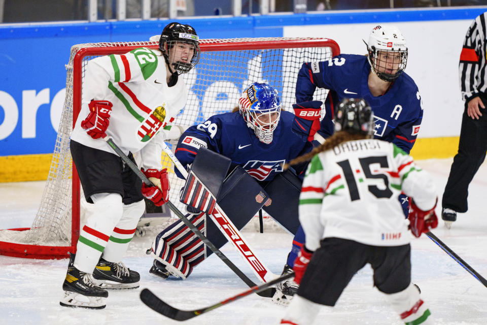 Goalkeeper Nicole Hensley and Lee Stecklein of USA, right, in action with Mira Seregely, left, and Reka Dabasi of Hungary during The IIHF World Championship Woman's ice hockey match between USA and Hungary in Herning, Denmark, Thursday, Sept. 1, 2022. (Bo Amstrup/Ritzau Scanpix via AP)