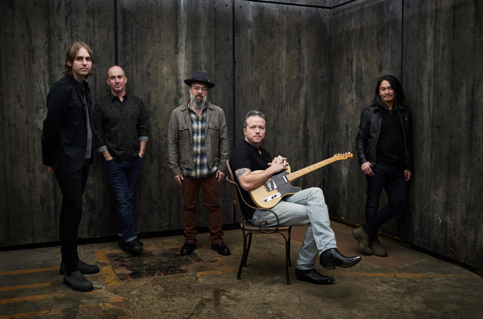 Jason Isbell, seated, with the band the 400 Unit