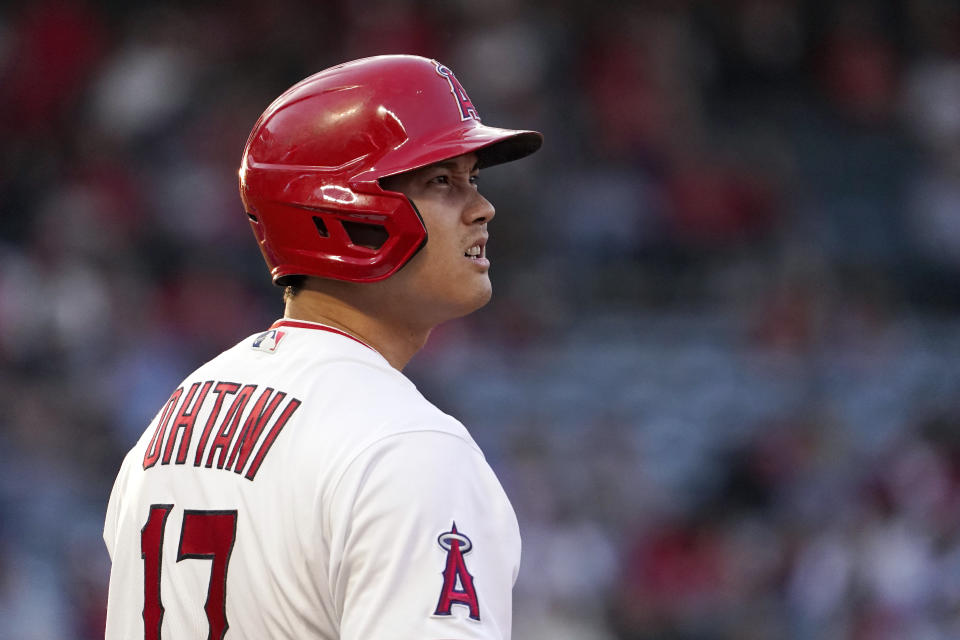 Los Angeles Angels' Shohei Ohtani stands on first during the third inning of a baseball game against the Texas Rangers Tuesday, May 24, 2022, in Anaheim, Calif. (AP Photo/Mark J. Terrill)
