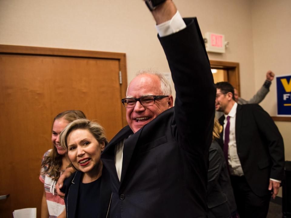 Rep. Tim Walz (D-MN) and his wife, Gwen Walz, celebrate while entering his election night party on August 14, 2018 in St Paul, Minnesota