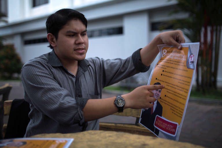 Bukhairy Sofian explains a manifesto from Gerakan Mahasiswa (Student Movement) at a university in Kuala Lumpur, on April 13, 2013. The 23-year-old student is fed up with a ban on political activity at Malaysian universities, which he calls an outdated shackle on a tech-savvy younger generation yearning to express itself