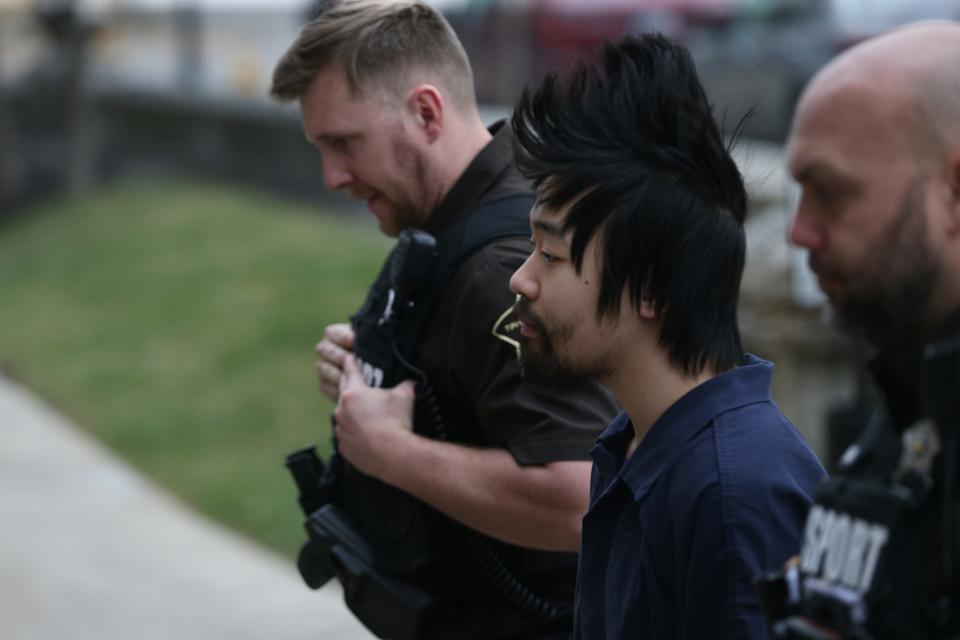 Deputies escort murder suspect Ji Min Sha, 23, into the Tippecanoe County Courthouse on March 24, 2023, for a hearing to determine if he is competent to stand trial. Sha is charged with killing his roommate, Varun Manish Chheda, 20, of Indianapolis, early Oct. 5, 2022, inside their Purdue University dorm room.