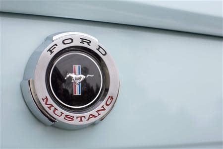 A Mustang badge is seen on Gail Wise's Skylight Blue 1964 1/2 Ford Mustang in Park Ridge, Illinois November 26, 2013. REUTERS/John Gress