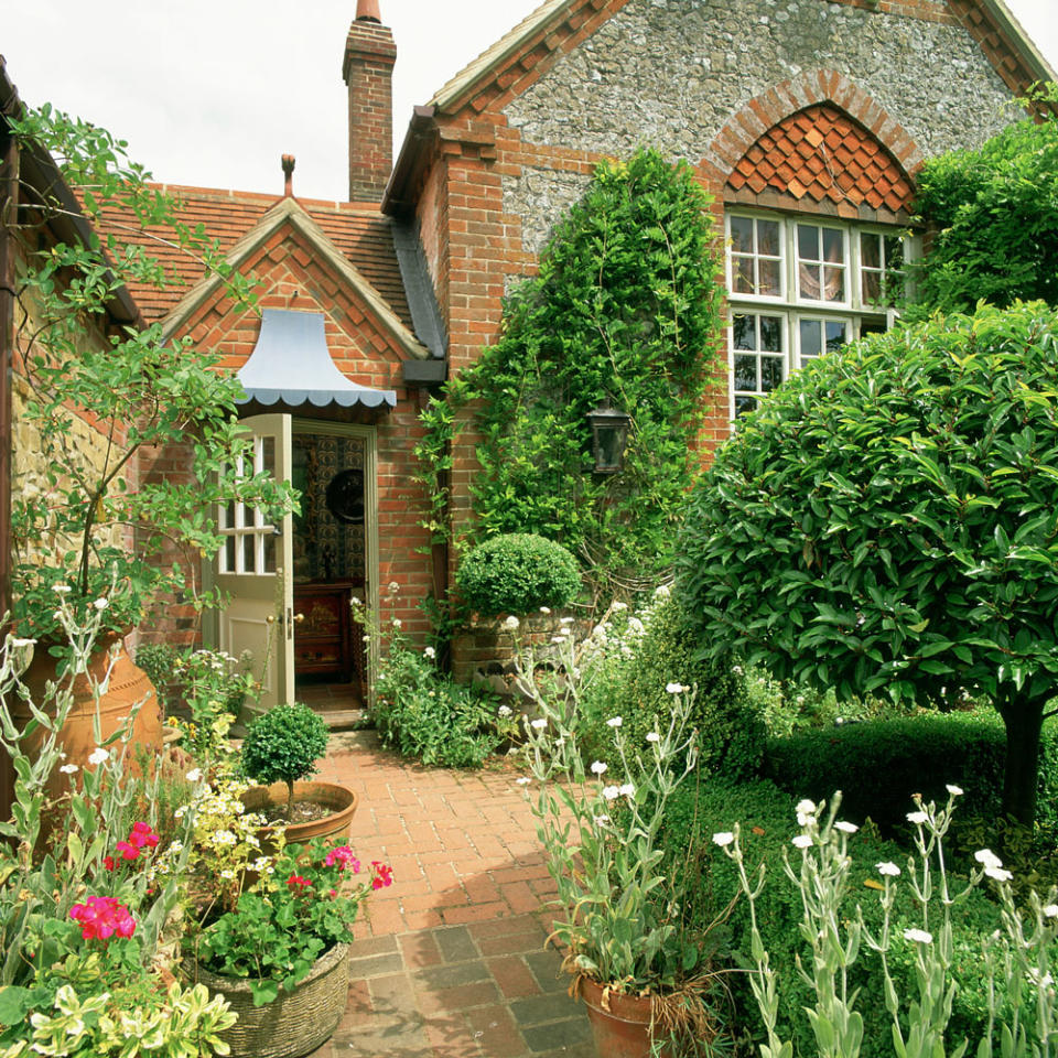 Lay a brick path, lined with pretty pots