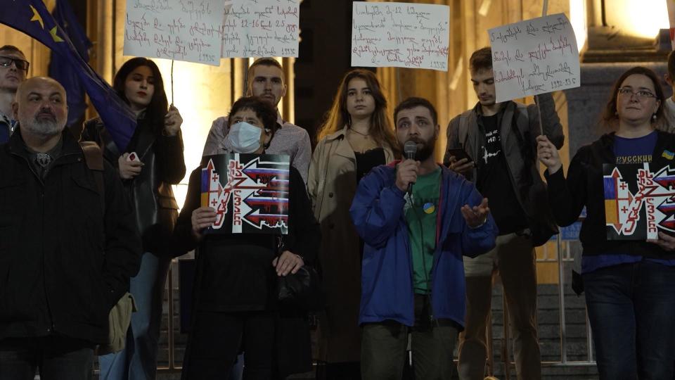 Georgians take part in a demonstration against Russia's leadership in the capital Tbilisi, demanding their own government close the border to Russian's fleeing conscription. / Credit: CBS News