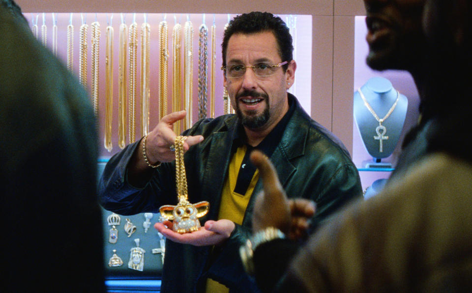 This image released by A24 shows Adam Sandler in a scene from "Uncut Gems." The Safdie brothers’ Diamond District crime film “Uncut Gems” and Robert Eggers’ fever-dream period tale “The Lighthouse” lead the 35th annual Film Independent Spirit Awards with five nominations each. The Spirit Awards will be held Feb. 8, the day before the Academy Awards. (A24 via AP)
