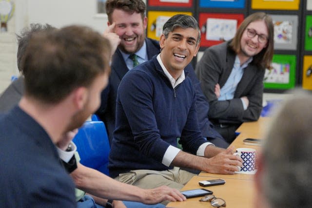 Prime Minister Rishi Sunak speaks to members of the media during a huddle while visiting Braishfield Primary School in Romsey, Hampshire, while on the General Election campaign trail 
