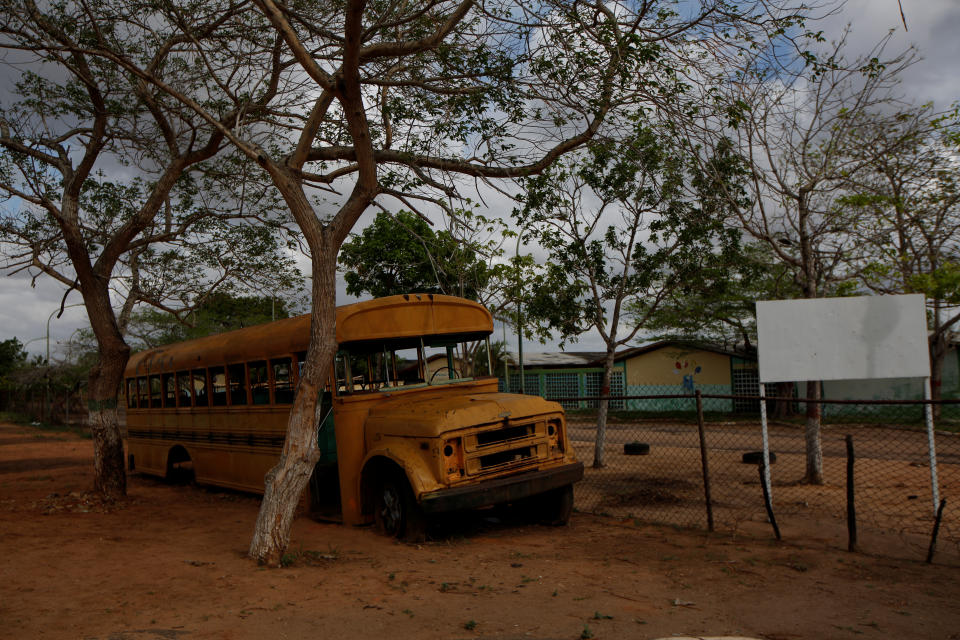 An out-of-service school bus remains near a school on the outskirts at El Tigre, Venezuela, on June 4. (Photo: Ivan Alvarado/Reuters)