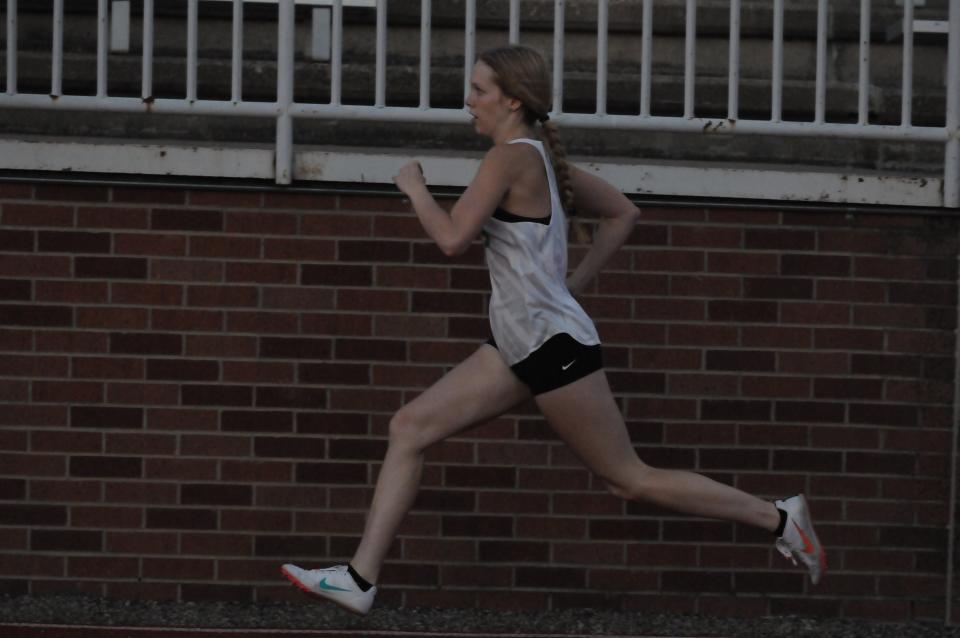 Salina South's Kylie Arnold begins the 1,600-meter relay during the AVCTL-I Championships Friday, May 13, 2022 at Salina Stadium.