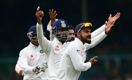 Cricket - India v New Zealand - First Test cricket match - Green Park Stadium, Kanpur, India - 23/09/2016. India's cricket players appeal unsuccessfully for the wicket of New Zealand's Tom Latham. REUTERS/Danish Siddiqui/Files