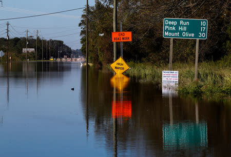 A road is blocked by flood waters in the aftermath of Hurricane Florence, now downgraded to a tropical depression, in Kinston, North Carolina, U.S., September 19, 2018. REUTERS/Eduardo Munoz