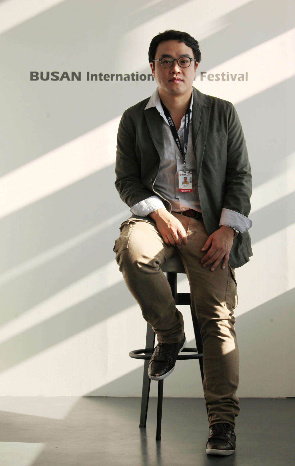 In this Oct.4, 2013 photo, South Korean Director Kim Taeyun of the movie "Another Family" poses during an interview at Busan Cinema Center in Busan, South Korea. “Another Family,” which premiered during the 18th Busan International Film Festival ending on Saturday, is a fictional account based on the story of Hwang Yu-mi, who died at the age of 23 from leukemia in 2007, four years after joining Samsung’s memory chip factory in Yongin, Korea. The title resonates widely in South Korea because it is a well-known Samsung advertising slogan. (AP Photo/Woohae Cho)